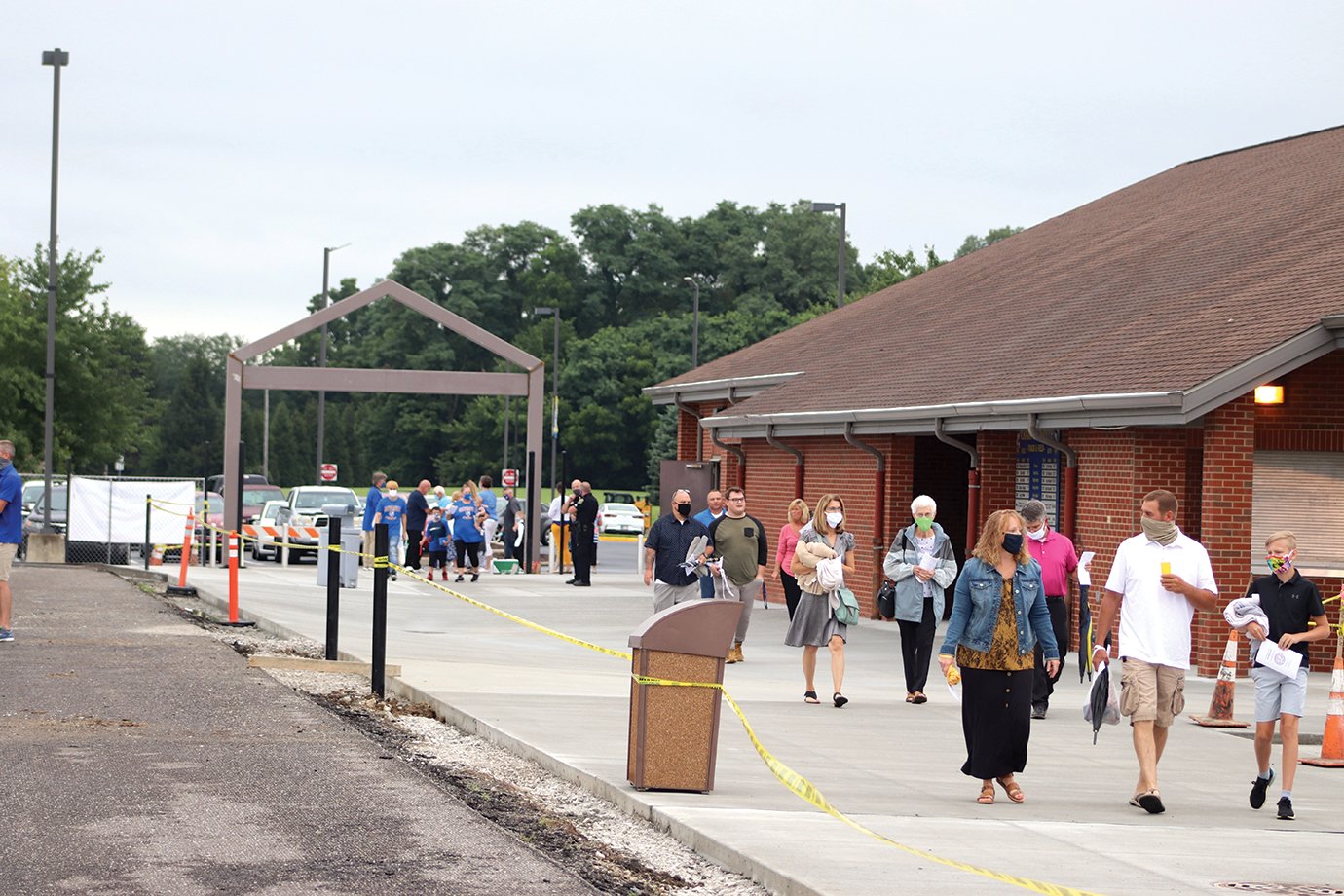 Crowds pour into the friendly confines of the Crawfordsville High School football stadium in the minutes leading up to the already-postponed ceremony under threat of rain.